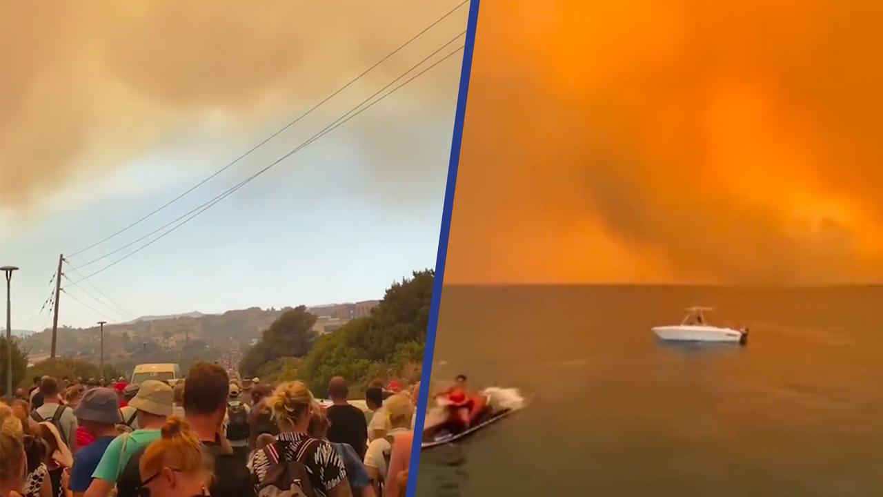 Beeld uit video: Toeristen ontvluchten het Griekse Rhodos vanwege hevige bosbranden