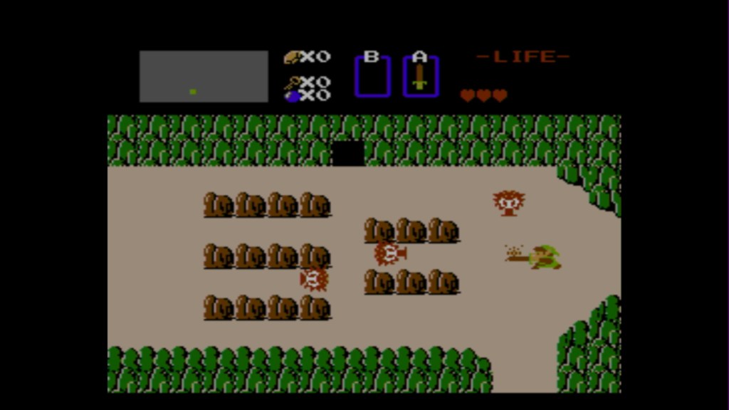 ein Screenshot von Link aus der Original-Legende von Zelda, der gegen Oktoroks kämpft