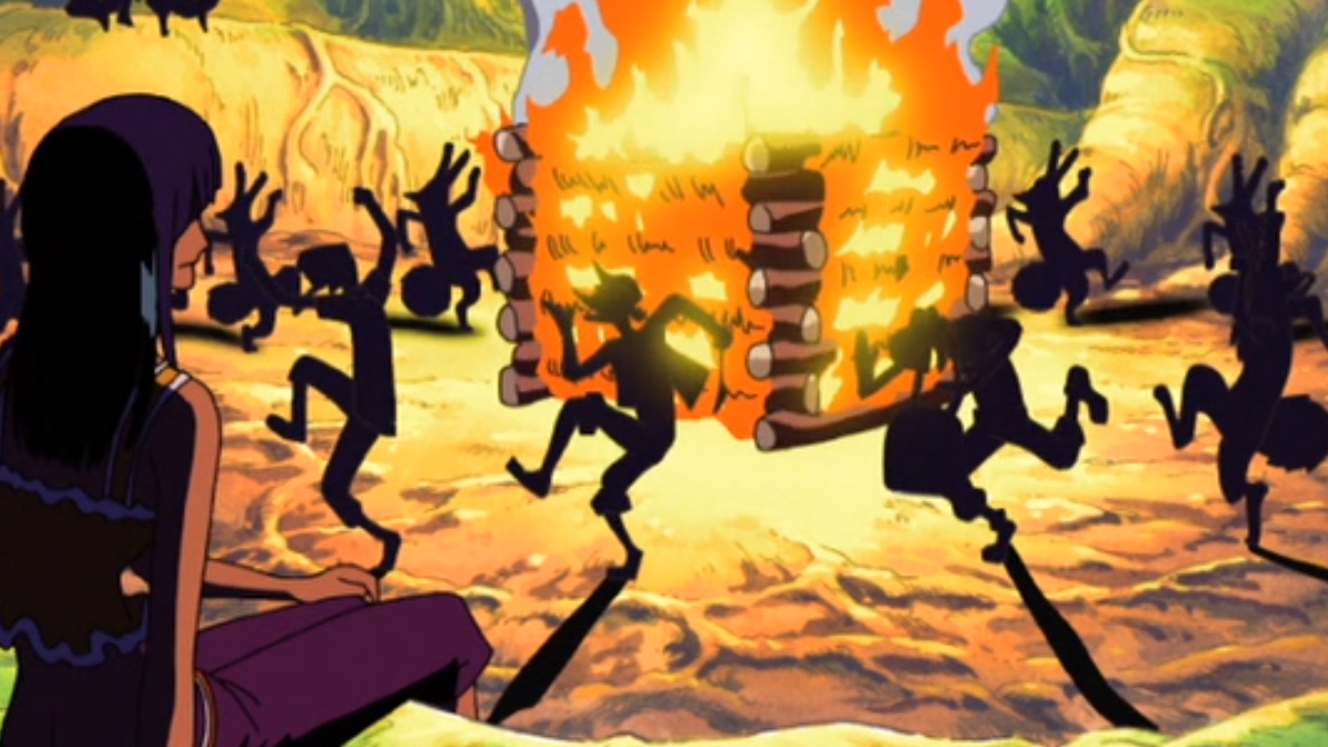 Bild von mehreren Figuren, die um ein großes Lagerfeuer tanzen und deren Schatten auf den Boden fallen