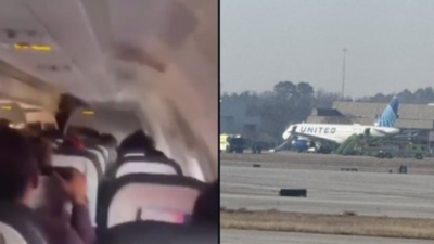 United Airlines United Airlines Flugzeug faengt Feuer auf den Landebahn