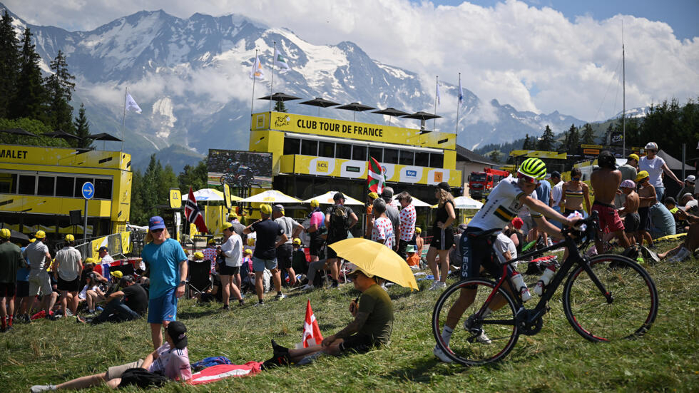 Spectators wait at the finish line of the Tour de France in Saint-Gervais, July 16, 2023.
