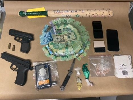 Two people arrested drugs and weapons seized during search