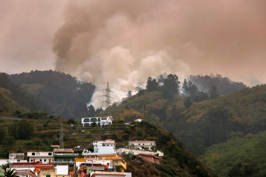 An out of control fire rages on the wooded slopes in La Matanza on the island of Tenerife in the Spanish Canary archipelago, August 19, 2023