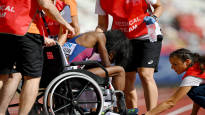 Athletes were wheeled away from the sweltering heat of the