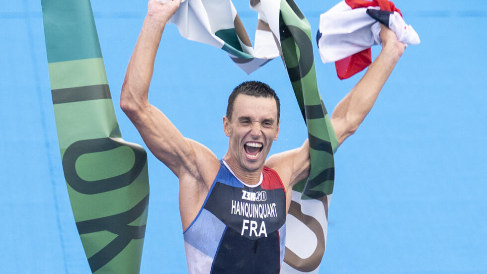 France's Alexis Hanquinquant celebrates after crossing the finish line of the paratriathlon PTS4 category during the Tokyo 2020 Paralympic Games.