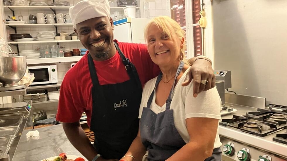 Christiane Olleval-Chiri could not find a cook for her restaurant, the Church Bar, in Luzy.  Once she got her papers, she hired Hassan Omer Hussein, a Somali refugee.