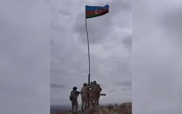 The Azerbaijani flag is flying in the regions taken from