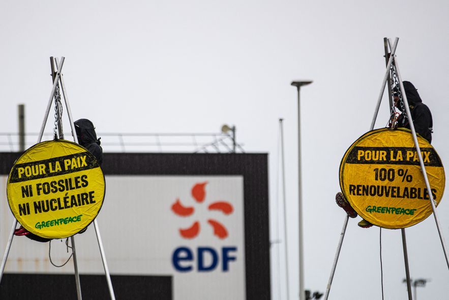 Greenpeace activists block the entrance to the EPR third generation nuclear reactor in Flamanville, Normandy, in protest against "irresponsibility" pro-nuclear presidential candidates, March 31, 2022