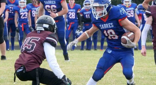 Sabers grind out 14 7 football victory