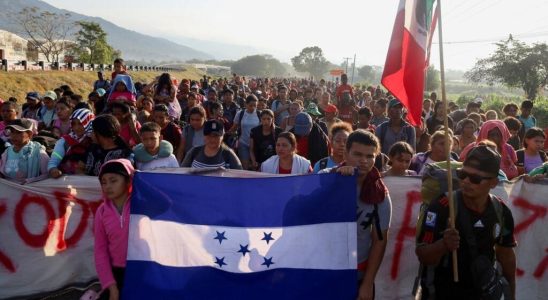 Thousands of migrants march toward the United States in an