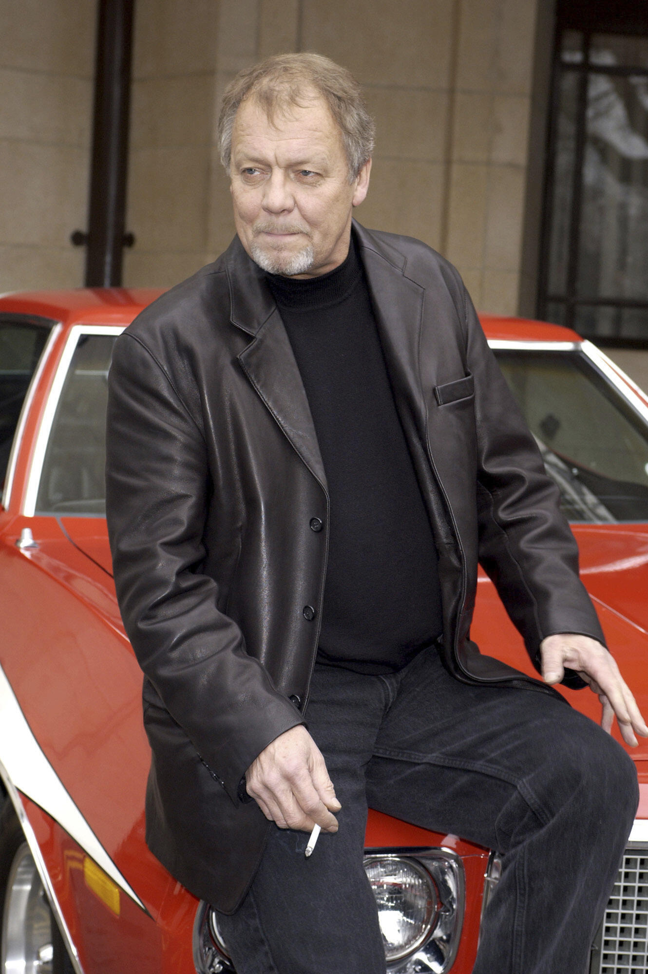 Actor David Soul sits outside the Dorchester Hotel before the UK premiere of 'Starsky and Hutch', in London, March 11, 2004.