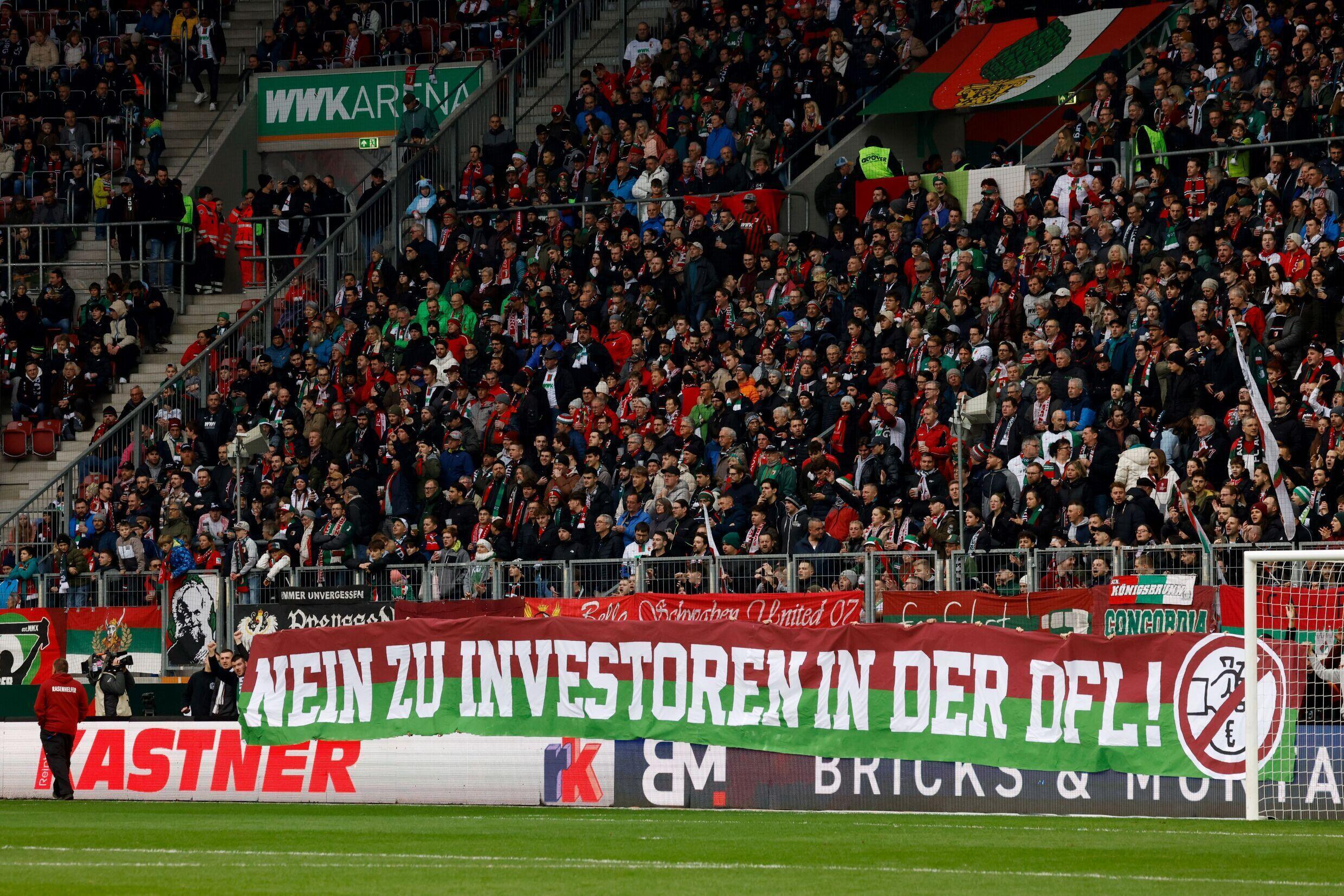 (ARCHIVES) A banner displayed in a stand stating “No to investors in the DFL” during the Bundesliga match between Augsburg and Leipzig, in Augsburg on February 10, 2024