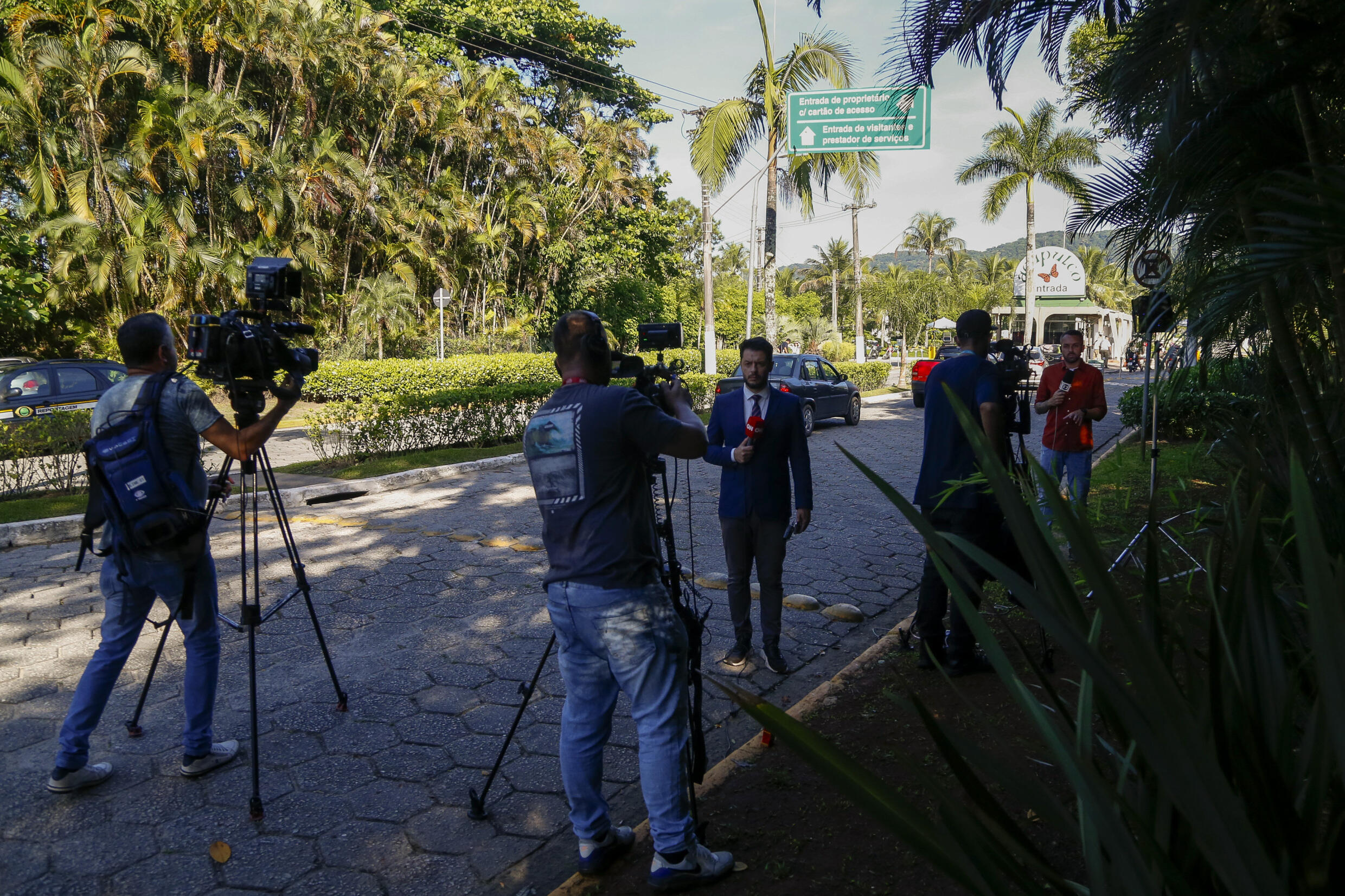 Journalists wait in front of the luxury residential complex where Robinho lives, March 21, 2024 in Guaruja, near Sao Paulo