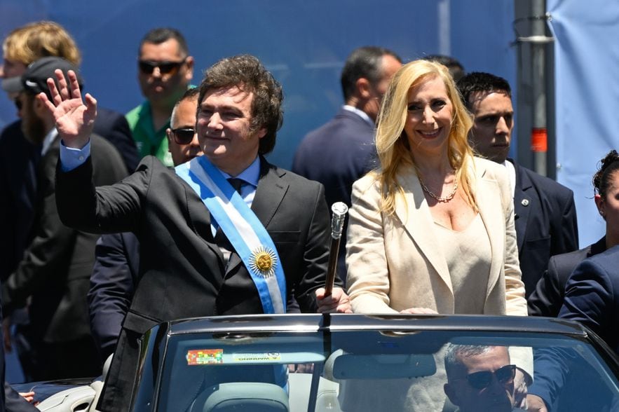 Argentina's new ultraliberal President Javier Milei and his wife Karina greet the crowd after his swearing in on December 10, 2023 in Buenos Aires 