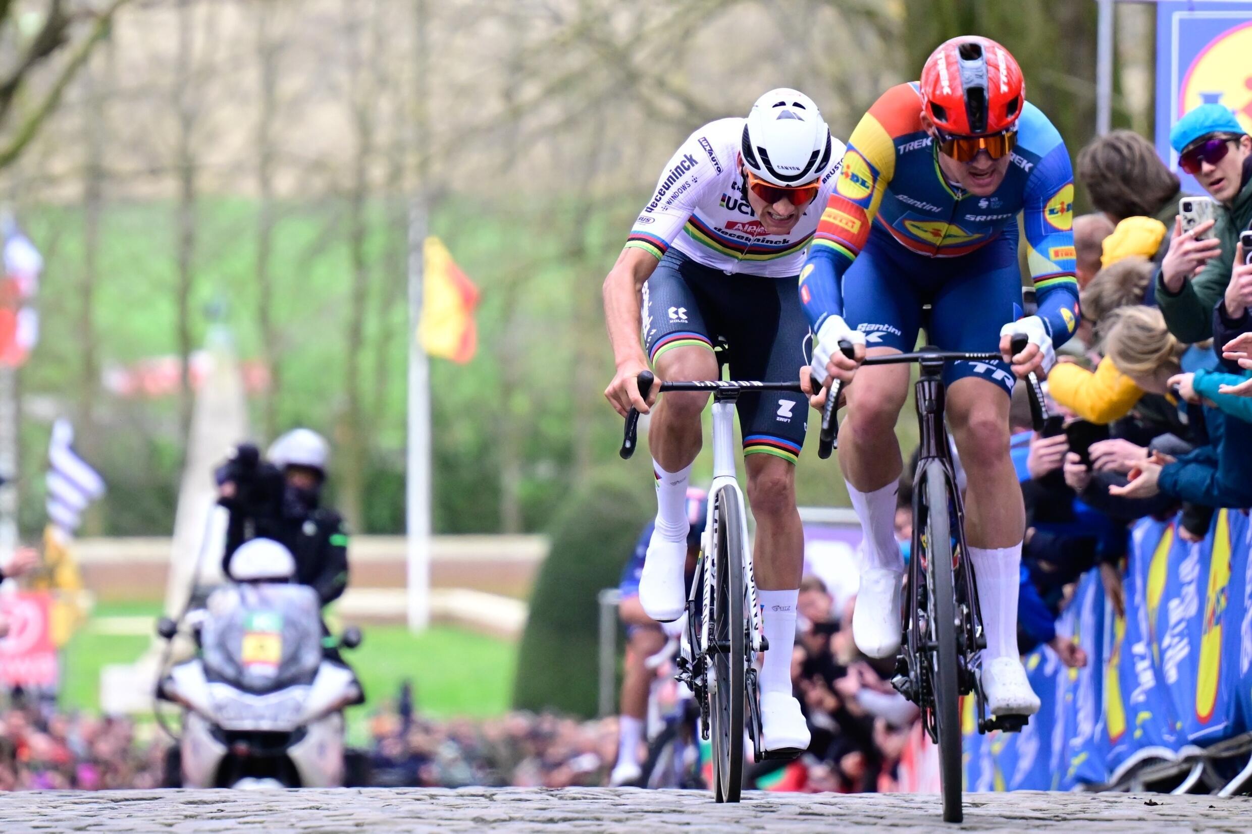 Dutch Alpecin-Deceuninck cyclist Mathieu van der Poel (left) and Dane from the Lidl-Trek team Mads Pedersen in a cobbled hill of the Ghent-Wevelgem classic in Belgium on March 24, 2023