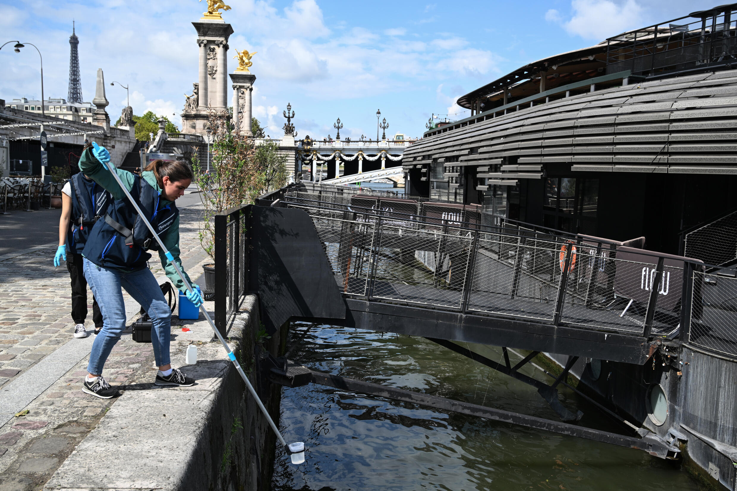 Taking a water sample from the Seine by the company Fluidion, August 4, 2023 in Paris
