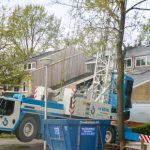 Sinking crane in residential area Leusden stabilized gas pipeline closed