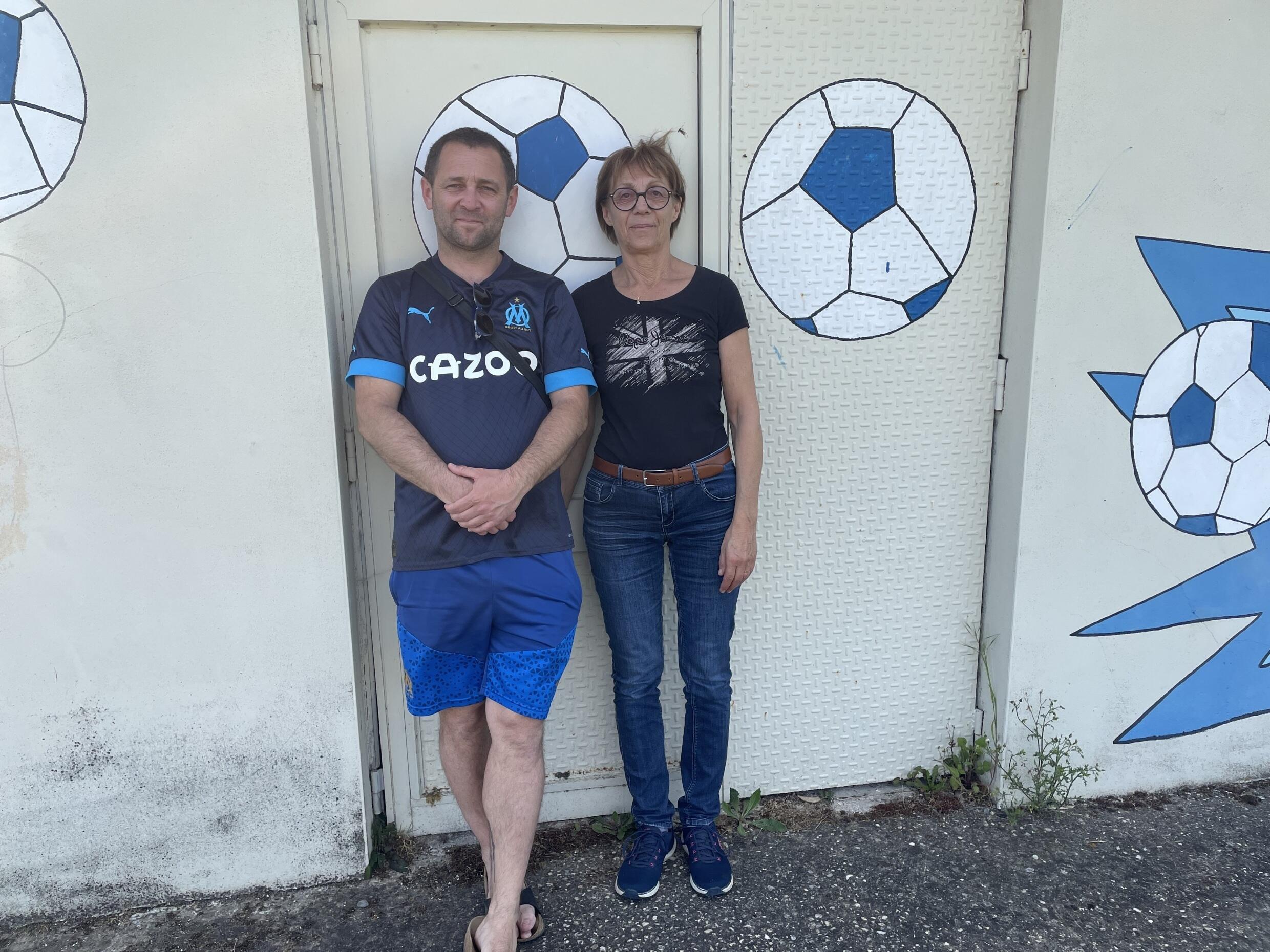 Clarisse Guinoiseau and her son Freddy, just in front of the locker rooms of the L'Huisserie club.