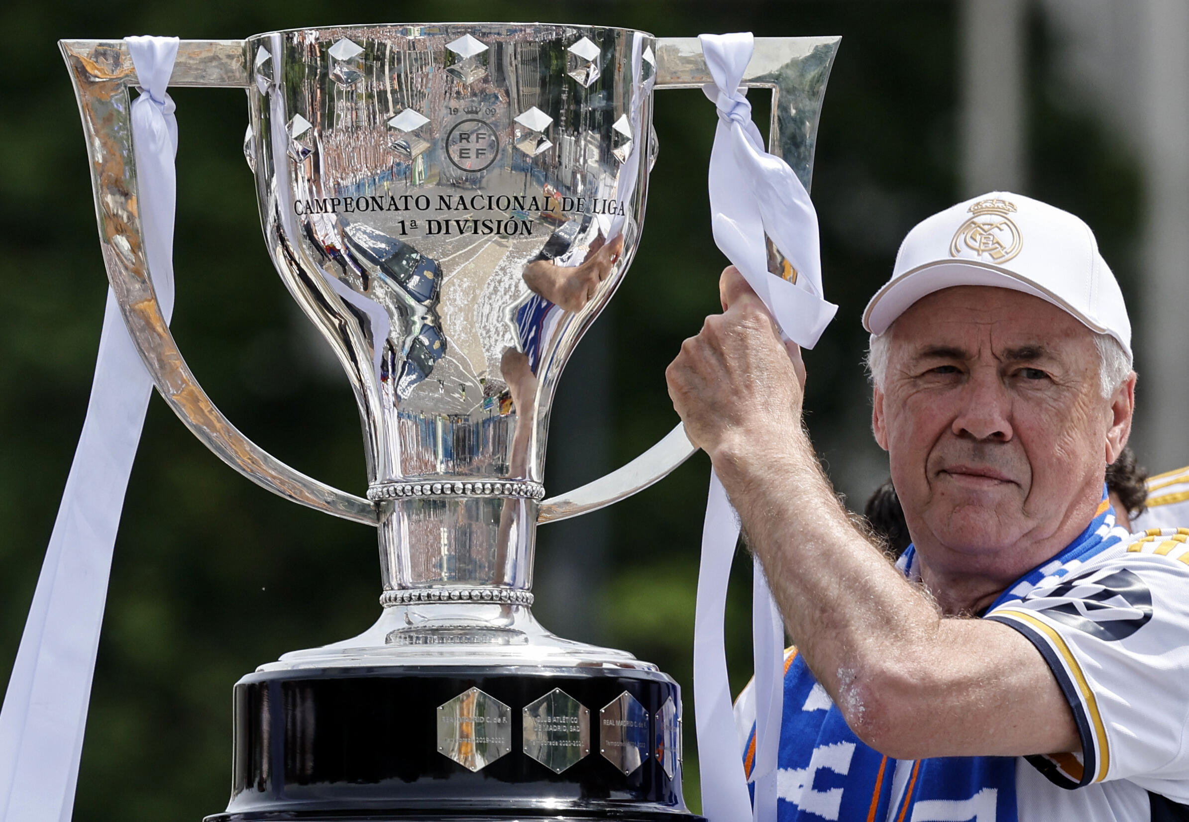 Carlo Ancelotti with the Spanish champion's cup, during a parade in the streets of Madrid, May 12, 2024