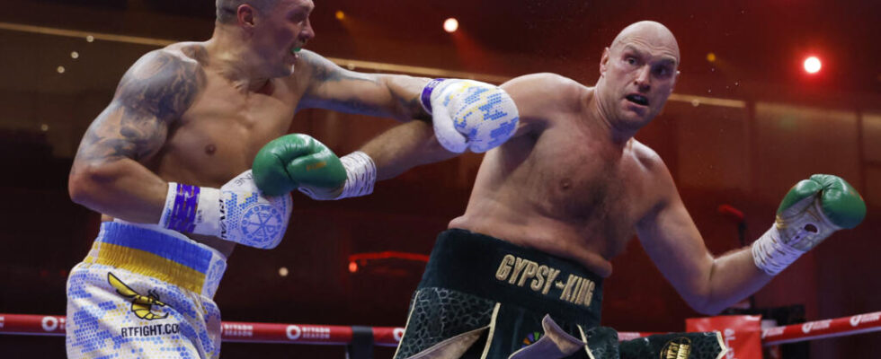 Usyk defeats Fury in split decision to become unified heavyweight