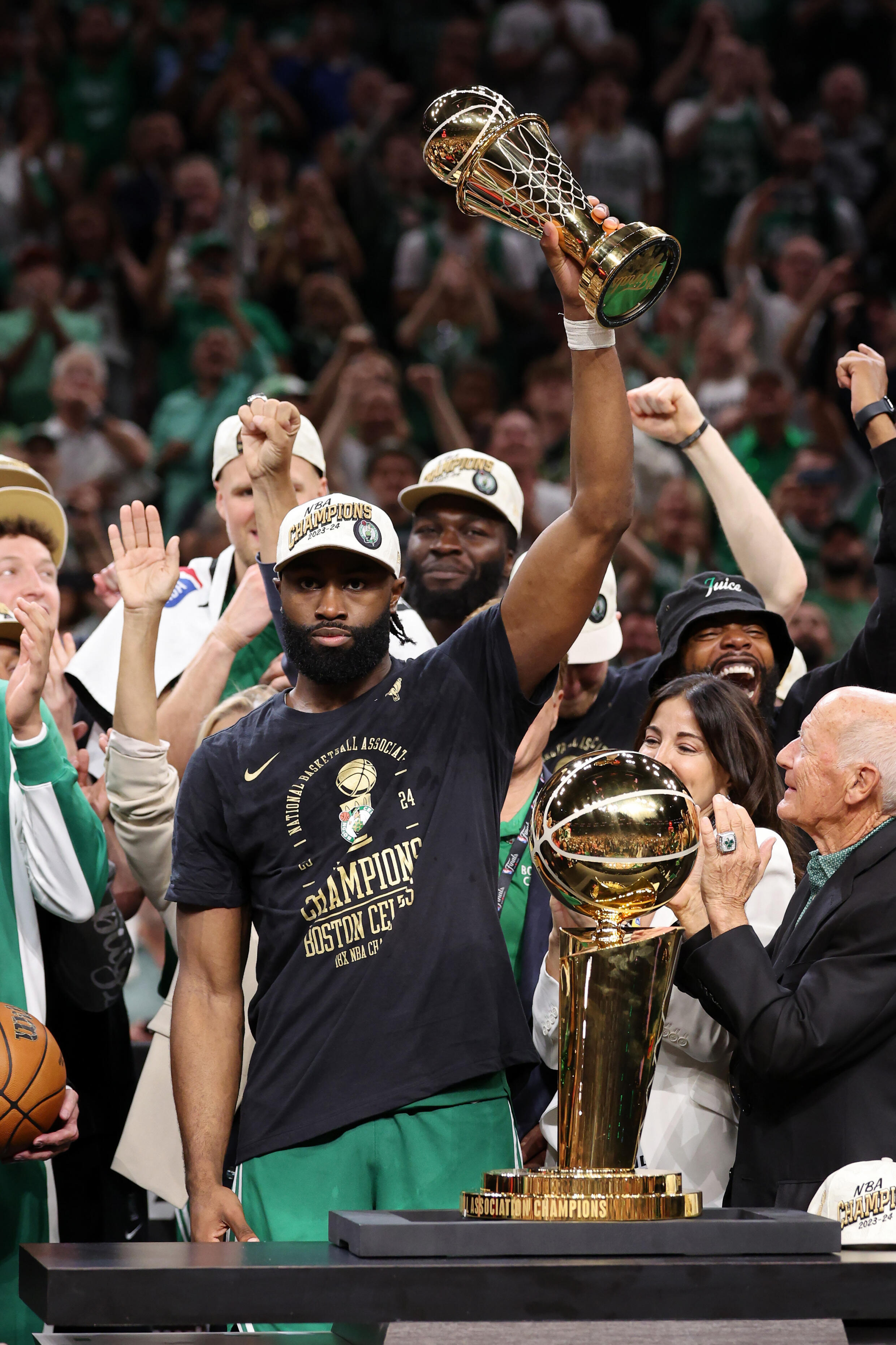 Jaylen Brown of the Boston Celtics holds up the NBA Finals MVP trophy after Boston's 106-88 victory over the Dallas Mavericks in Game 5 of the 2024 NBA Finals at TD Garden in Boston on June 17, 2024.