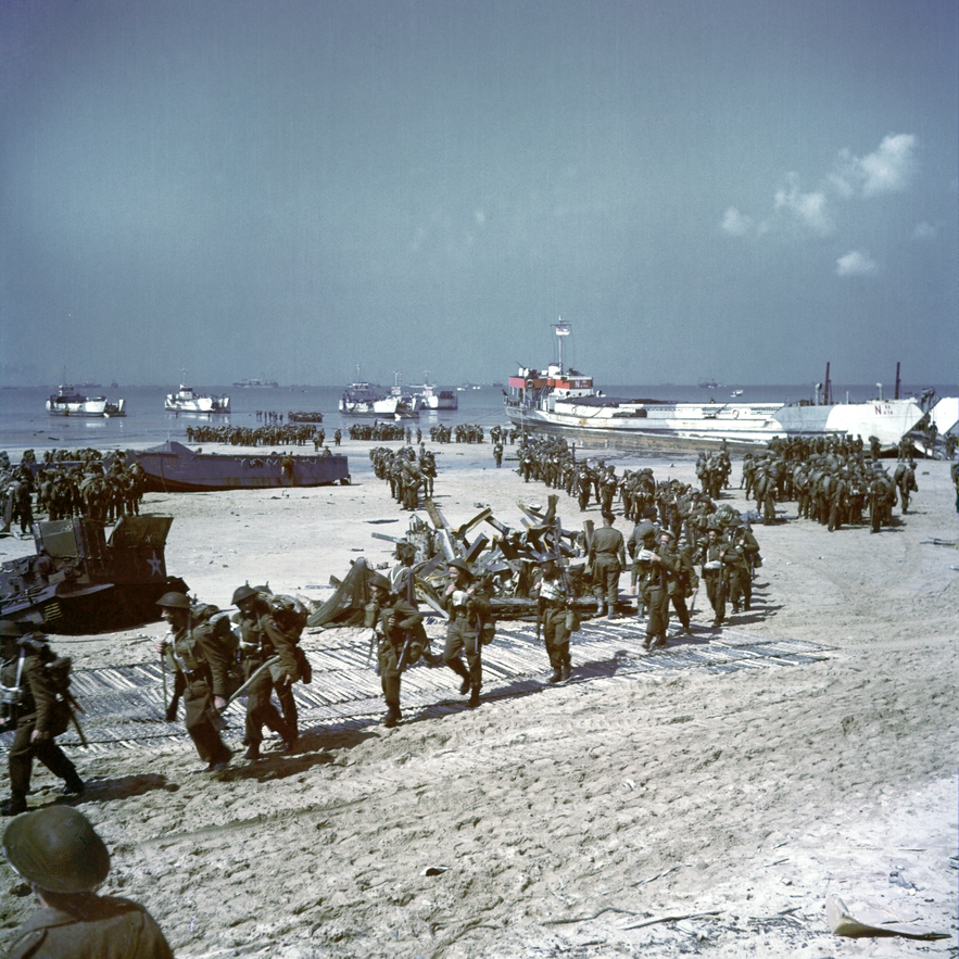Soldiers of the 9th Canadian Infantry Brigade disembark at Bernières-sur-Mer, June 6, 1944