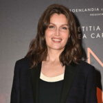 Curly hair and plunging neckline Laetitia Casta is at the