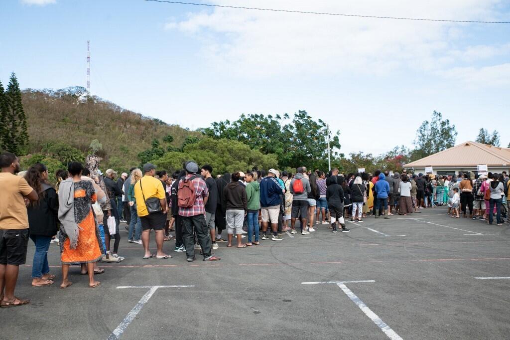 New Caledonian voters queue at a polling station in Vallée-du-Tir in Noumea on July 7.