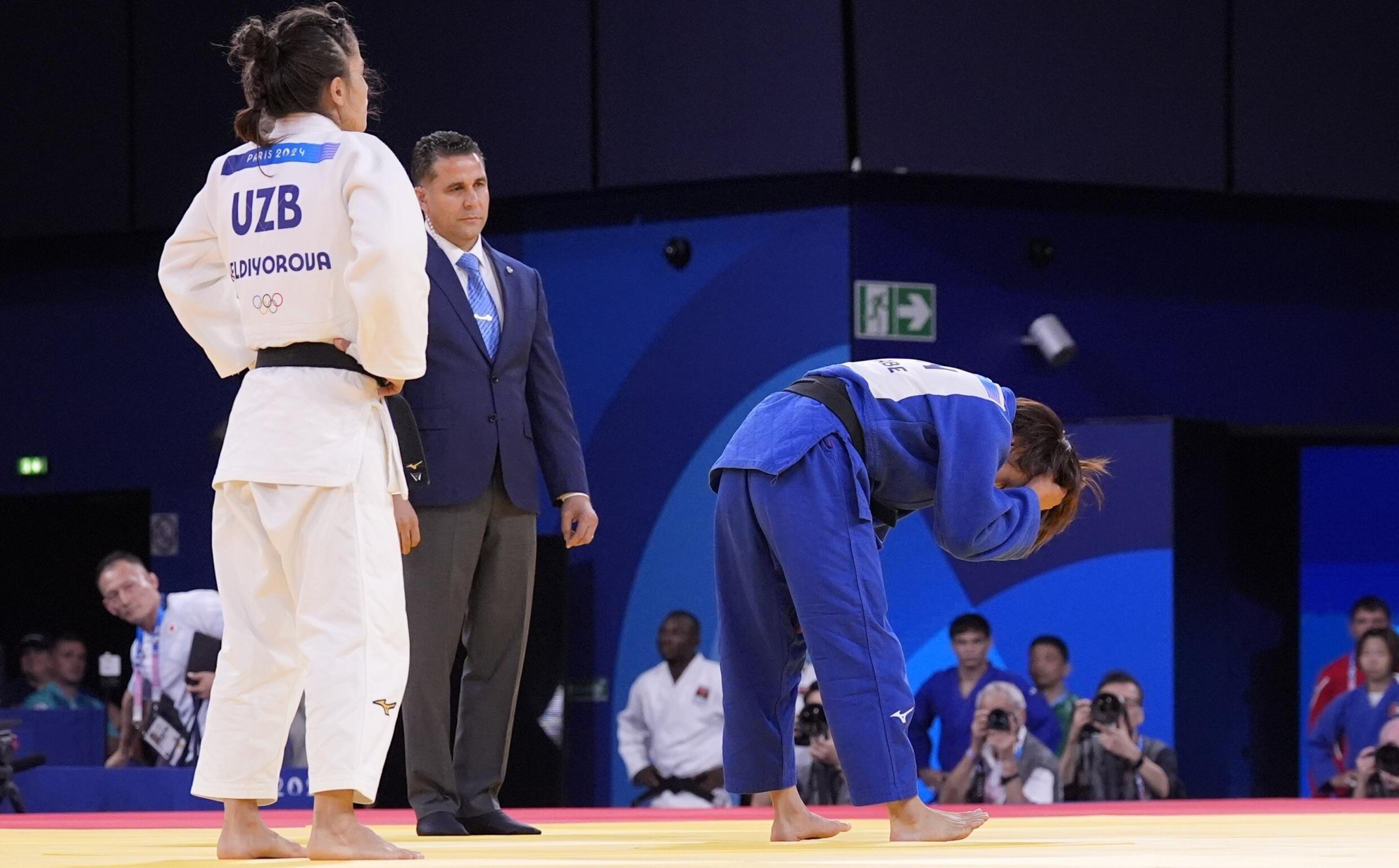 Japan's Uta Abe (in blue) was undefeated since 2019 before her round of 16 loss at the Paris Games to Uzbekistan's Diyora Keldiyorova.