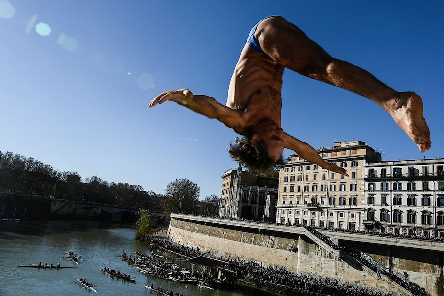 Italian Marco Fois dives into the Tiber on January 1, 2019 from the Cavour Bridge in Rome, faithful to a tradition that is more than 70 years old for New Year's Eve