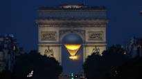 A magical sight delights in Paris when the Olympic flame