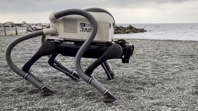 A robot dog with brooms on all four legs has