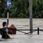 Floods and landslides kill at least ten people