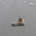 Why do we often find orphaned shoes on the highway