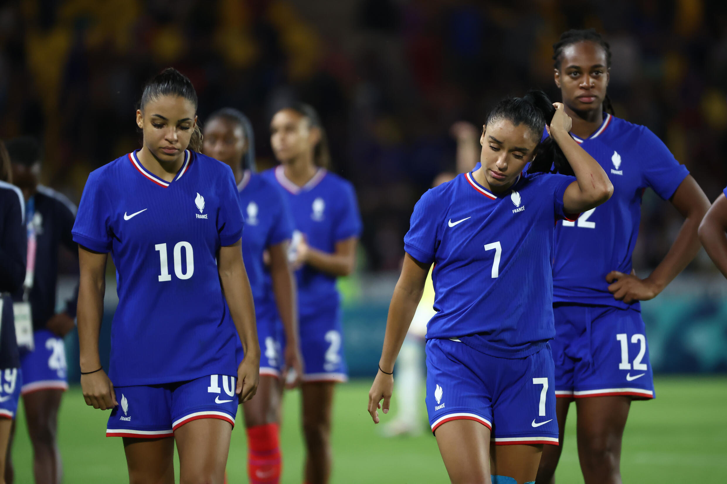 French players Sakina Karchaoui (N.7) and Delphine Cascarino (N.10) dejected after their defeat against Brazil in the quarter-finals, August 3, 2024 in Nantes