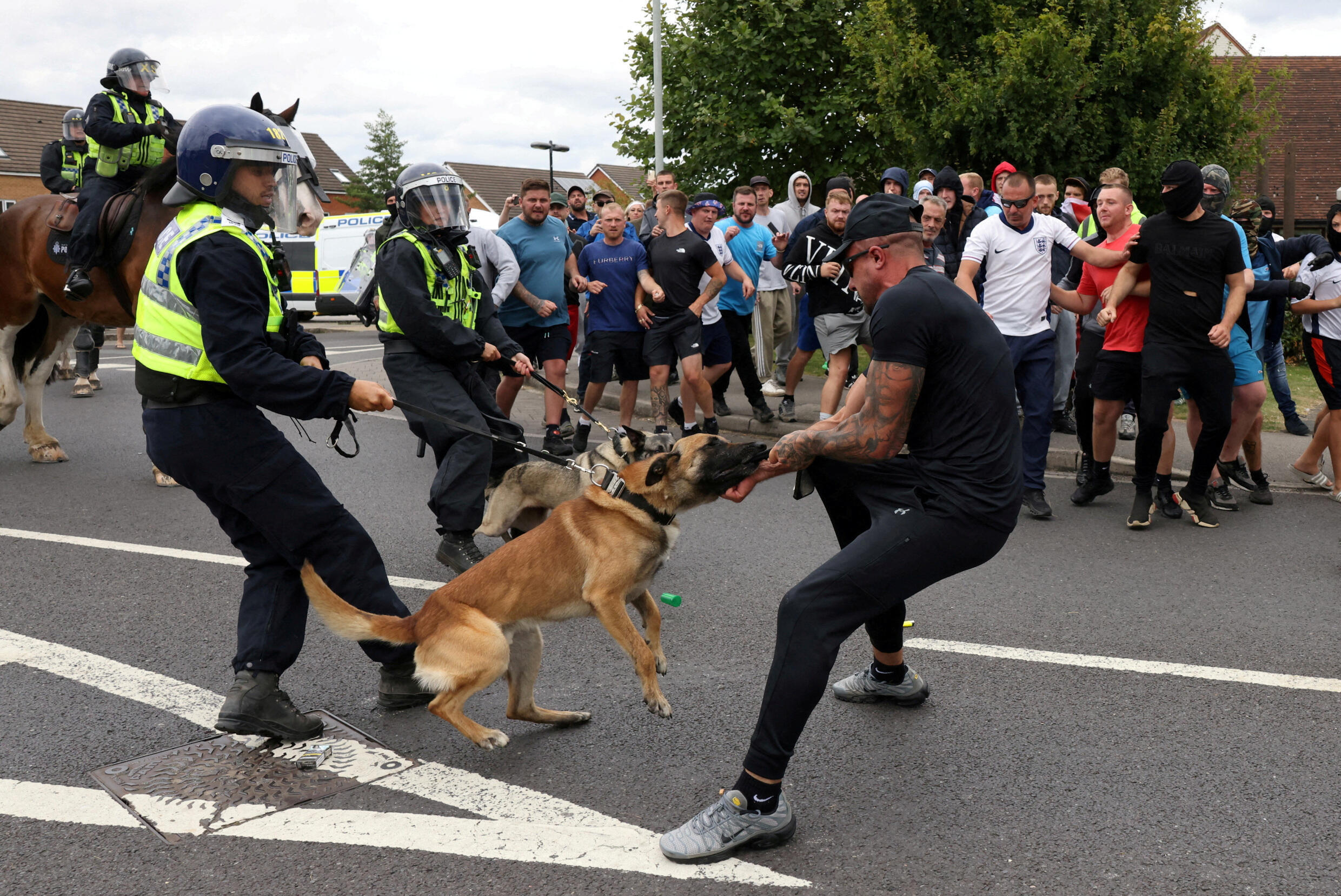 Police respond with police dogs in Rotherham, northern England, on August 4, 2024.