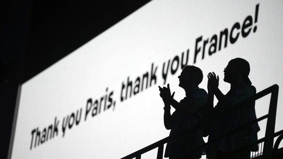 Spectators applaud during the closing ceremony of the 2024 Summer Olympics at Stade de France on August 11, 2024 in Saint-Denis, France.