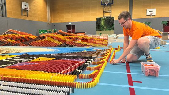 Builders from several countries work on a new domino record