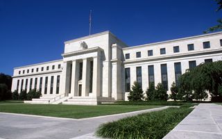 Fed leaves rates unchanged alerts to risks on both sides