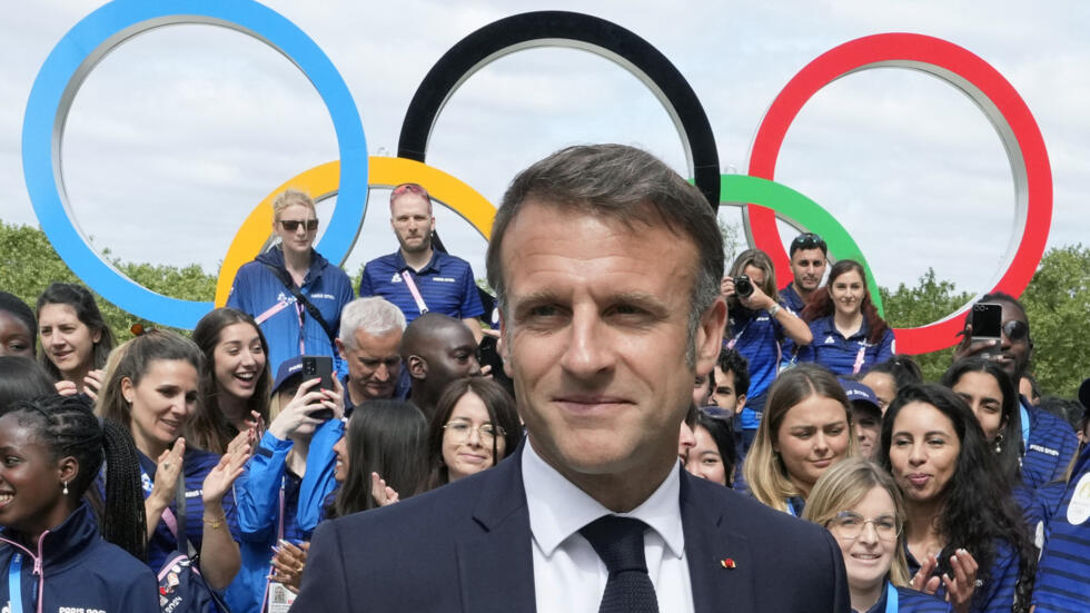 Ahead of the opening ceremony of the Paris 2024 Olympic and Paralympic Games, French President Emmanuel Macron looks at the Olympic rings on display behind him, in Saint-Denis, northern Paris, on July 22, 2024. (Illustration image).