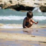 This activity of many children on the beach is more