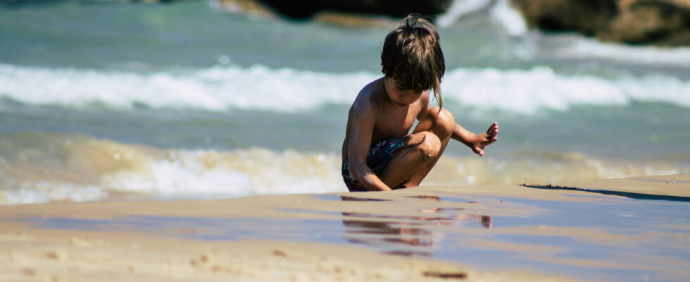 This activity of many children on the beach is more