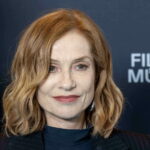 With her notched bob and red lips Isabelle Huppert takes