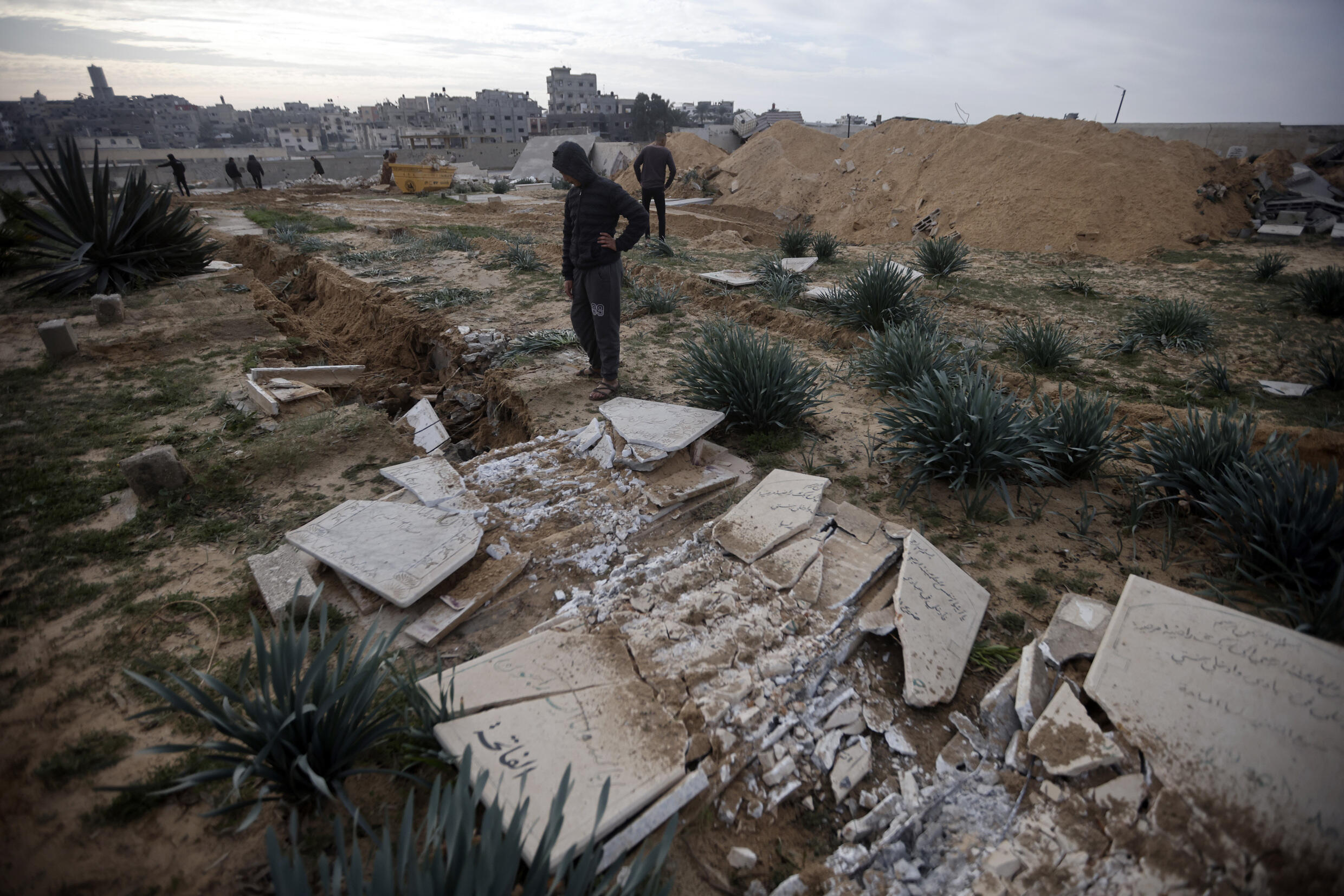 Graves damaged following an Israeli tank raid on a cemetery in the Khan Yunis refugee camp in the southern Gaza Strip, Wednesday, January 17, 2024.