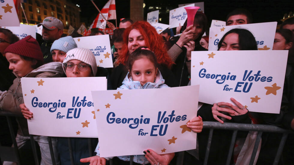 Protesters attend an opposition rally ahead of next week's parliamentary elections in Tbilisi, Georgia, Sunday, October 20, 2024.