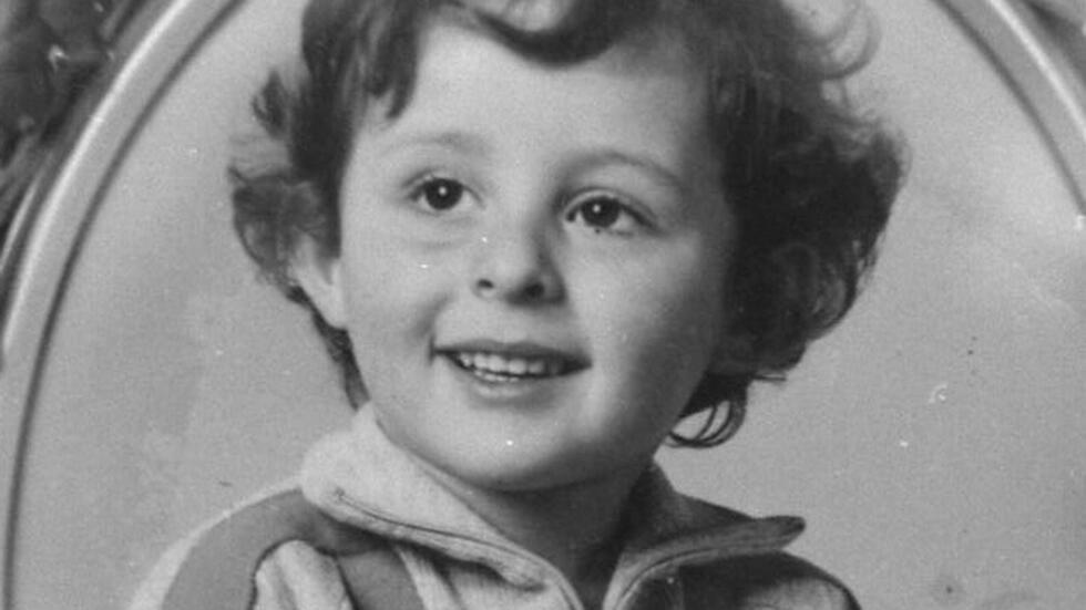 Photo (undated) of Grégory Villemin on the grave of the little boy, found dead bound hand and foot in Vologne on October 16, 1984.