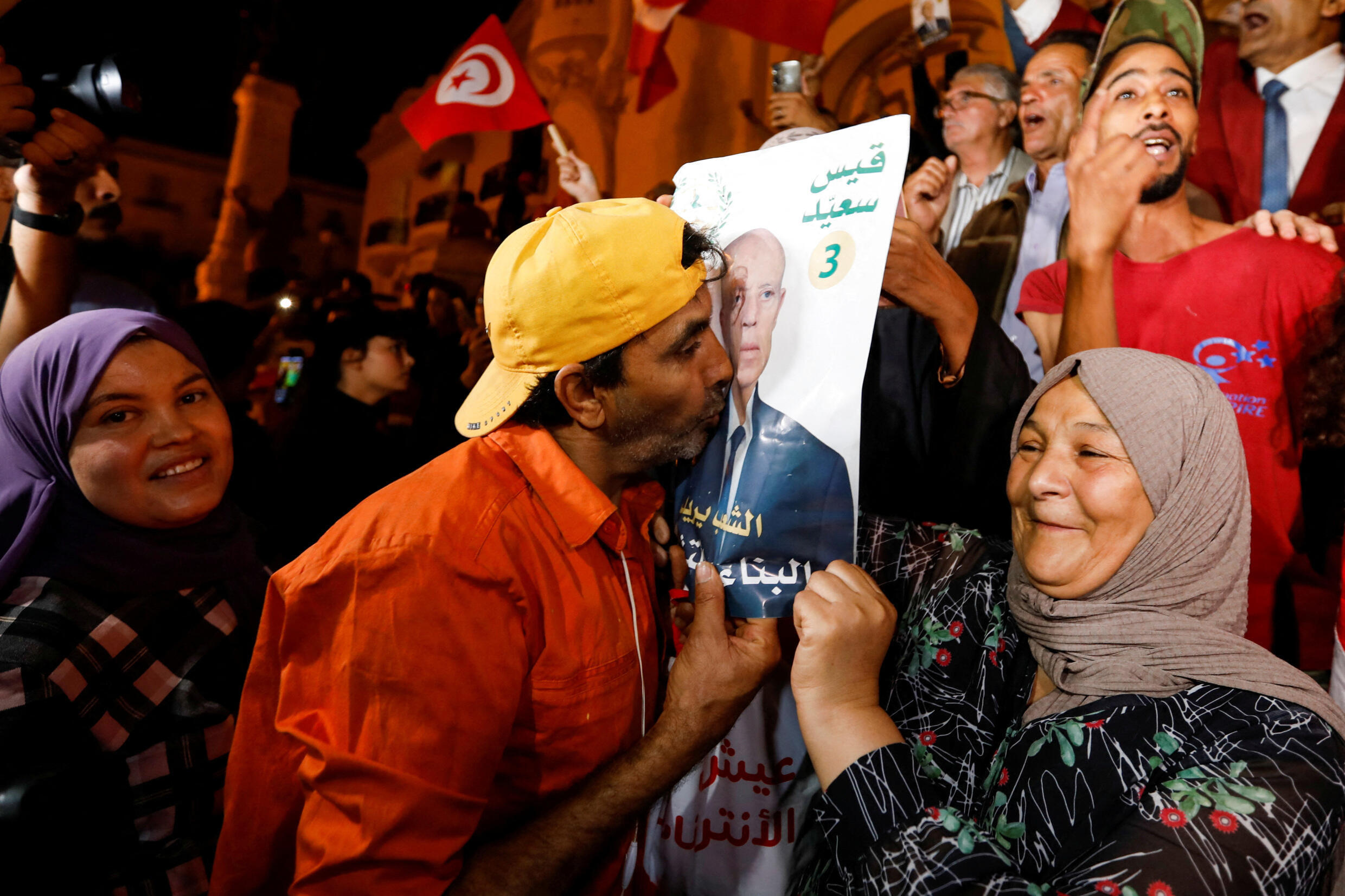 Supporters of Tunisian President Kaïs Saïed celebrate as exit polls show Saïed won the presidential election in Tunis, October 6, 2024.