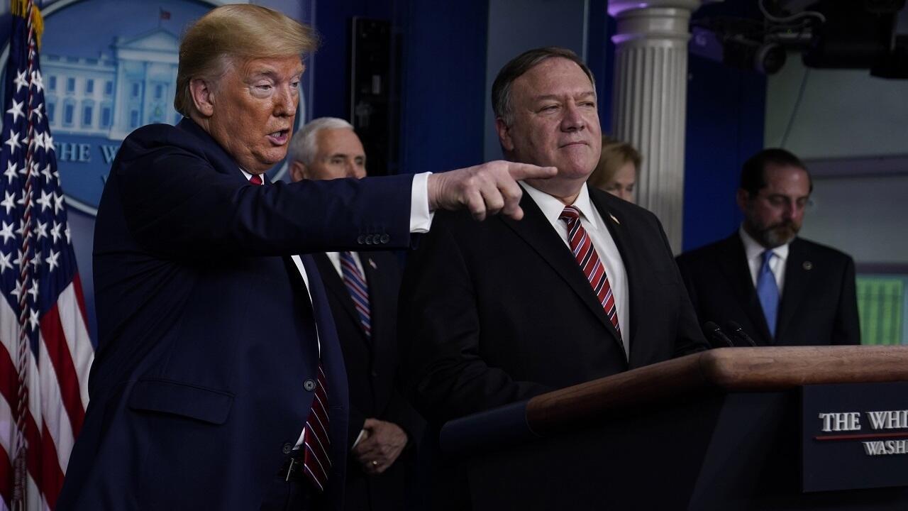 Donald Trump (left) speaking alongside Mike Pompeo (right) from the White House in Washington, March 20, 2020.