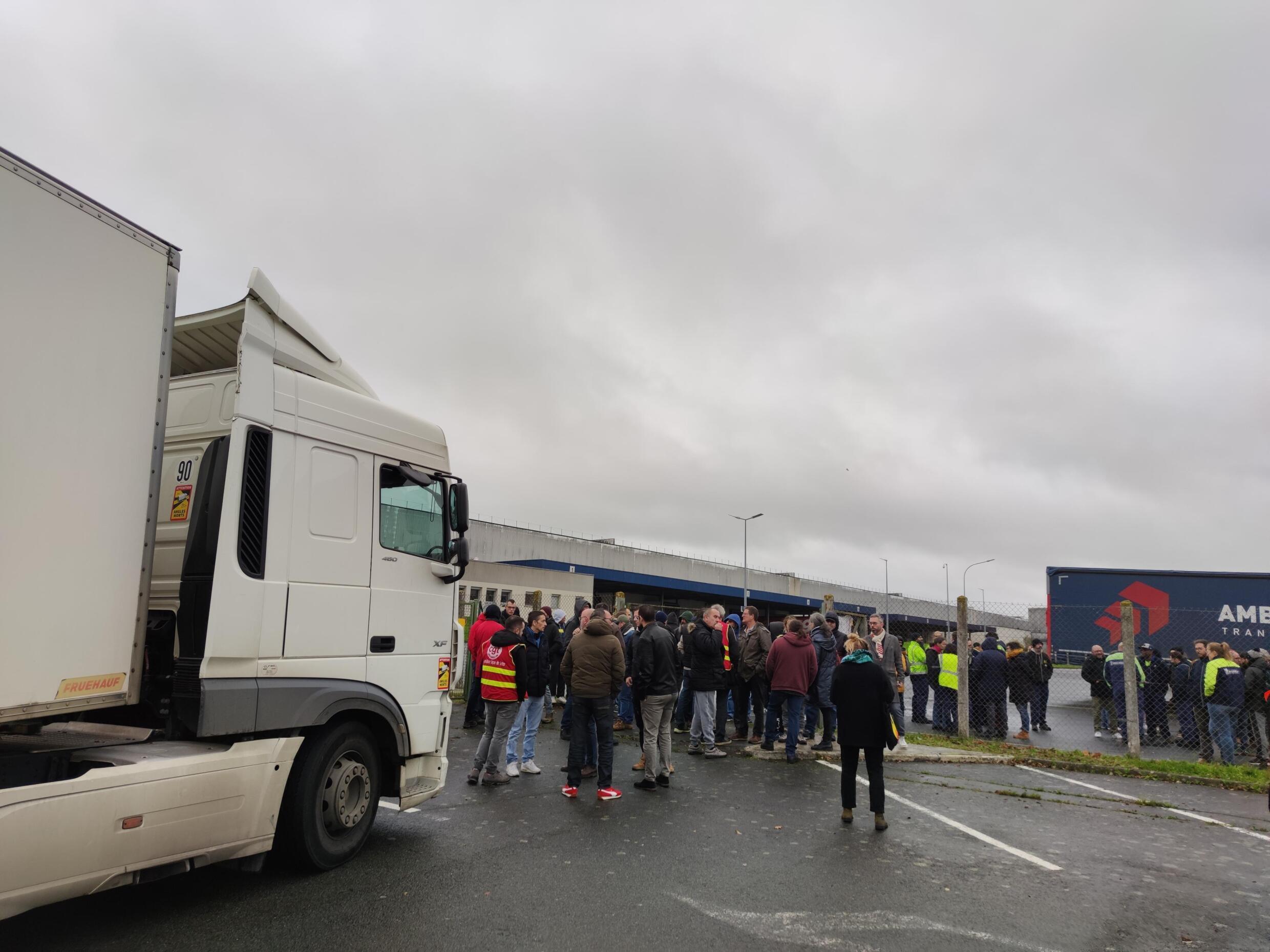 A truck is blocked by the workers, their means of pressure to make themselves heard by management.