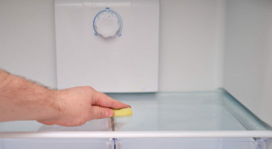 Water collects in the bottom of the refrigerator this